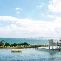 Intimate dinner on the over water infinity pool at Secrets Playa Mujeres Golf and Spa