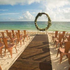 Ceremony decor on the beach wedding venue at Secrets Playa Mujeres Golf and Spa