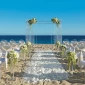 Ceremony decor on the beach wedding venue at Secrets Puerto Los Cabos Golf & Spa Resort
