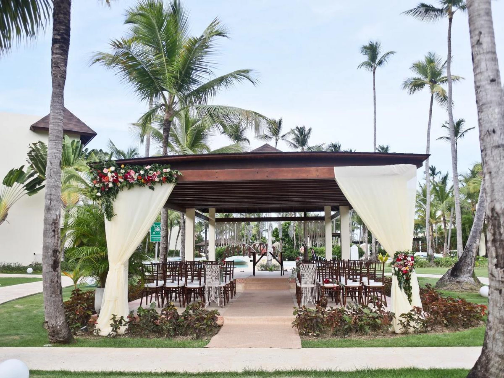 Ceremony in the tropical garden at Secrets Royal Beach Punta Cana