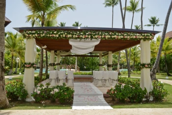 Ceremony decor in the tropical garden at Secrets Royal Beach Punta Cana