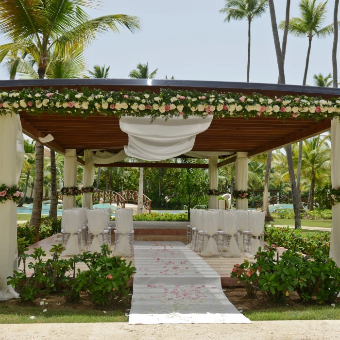 Ceremony in the tropical garden at Secrets Royal Beach Punta Cana