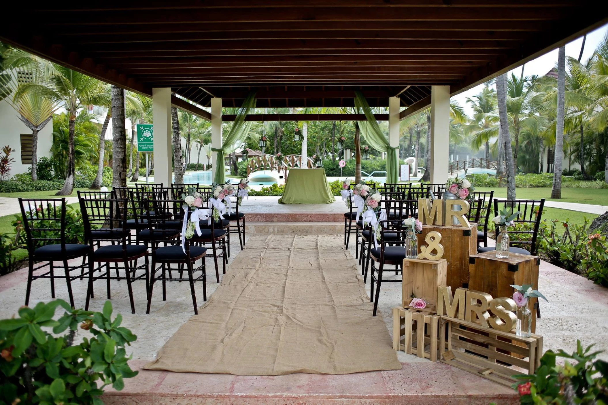 Ceremony decor in the tropical garden at Secrets Royal Beach Punta Cana