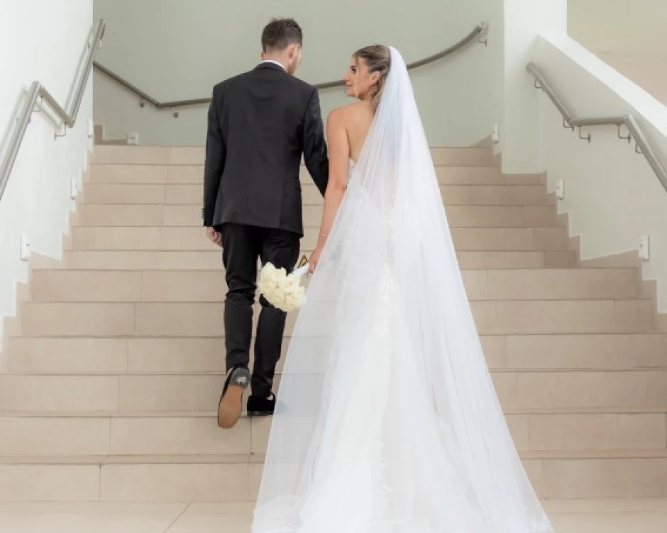 Andreana and Alessandro walk up the stairs