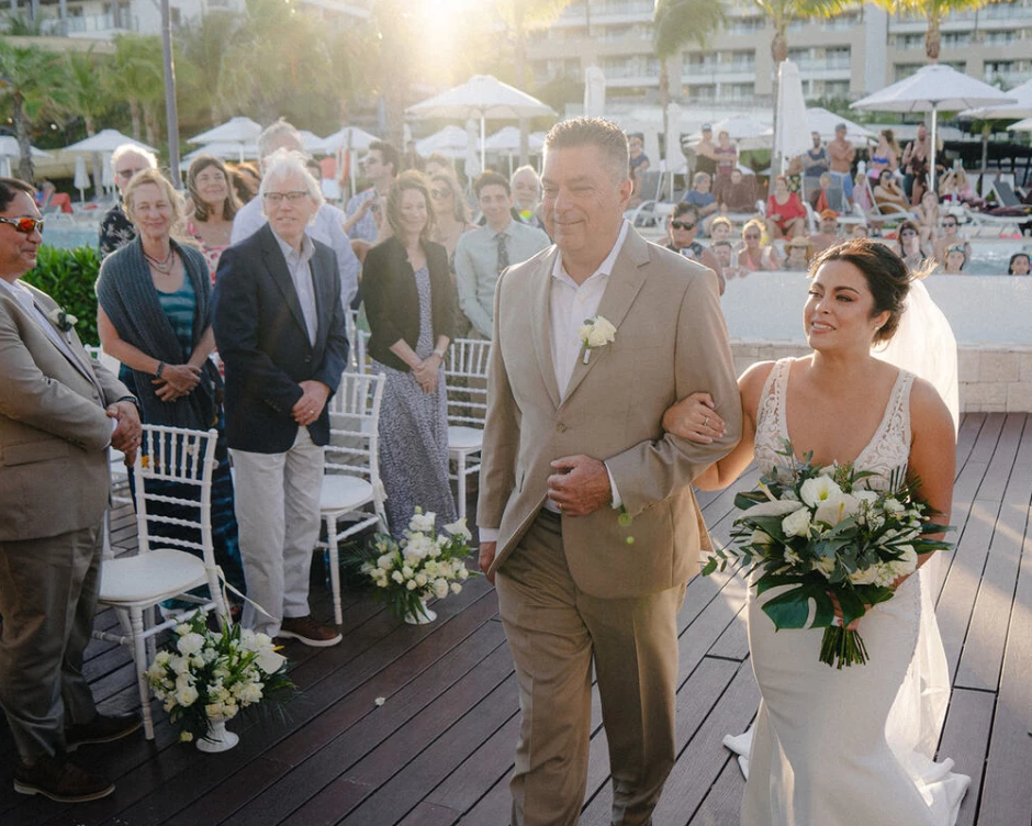 bride Alexis walks down the aisle