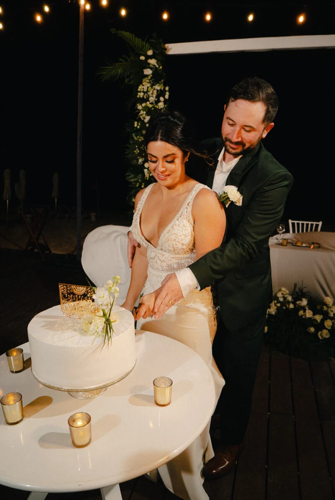 Drew and Alexis cut their wedding cake