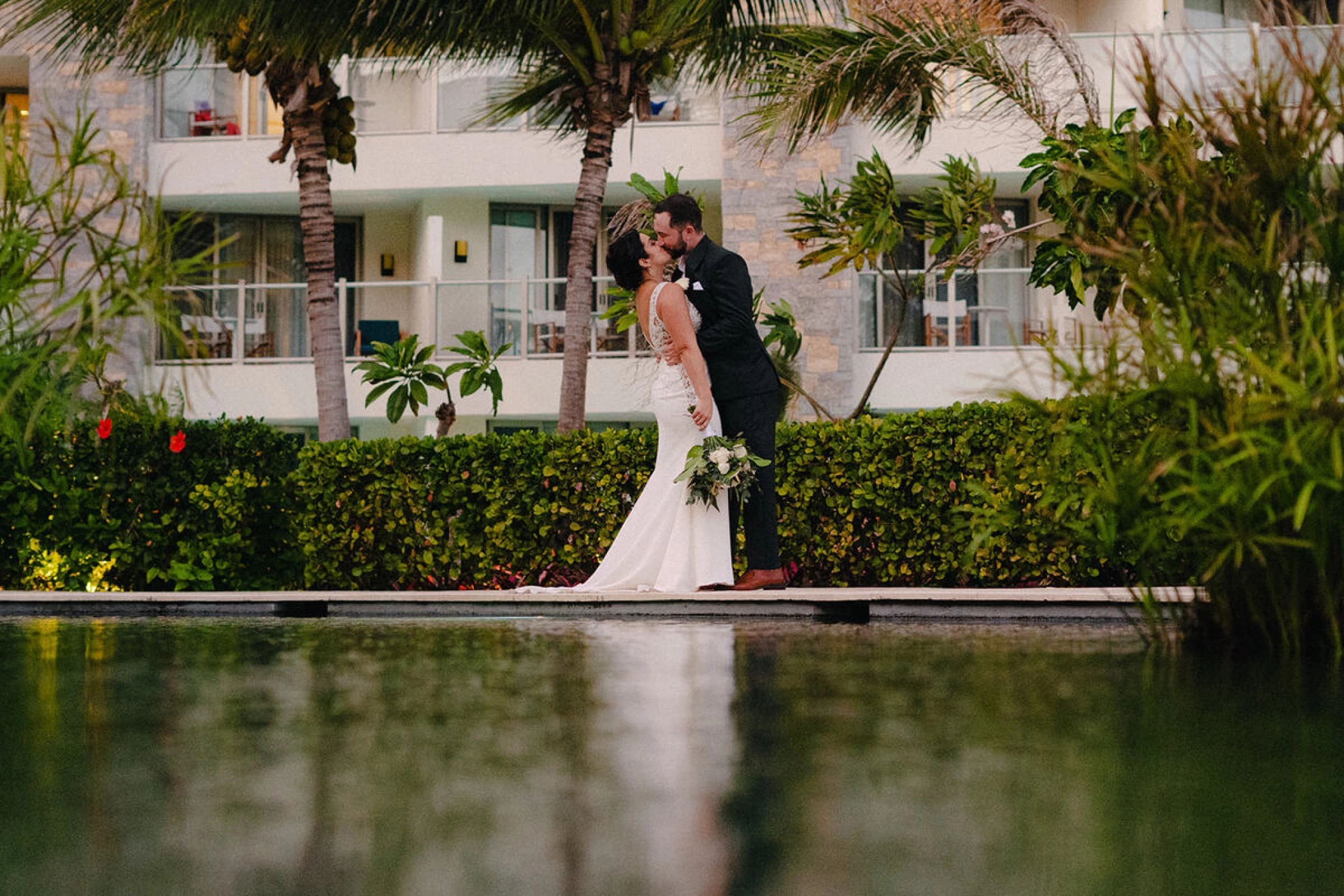 Drew and Alexis kiss by the pool