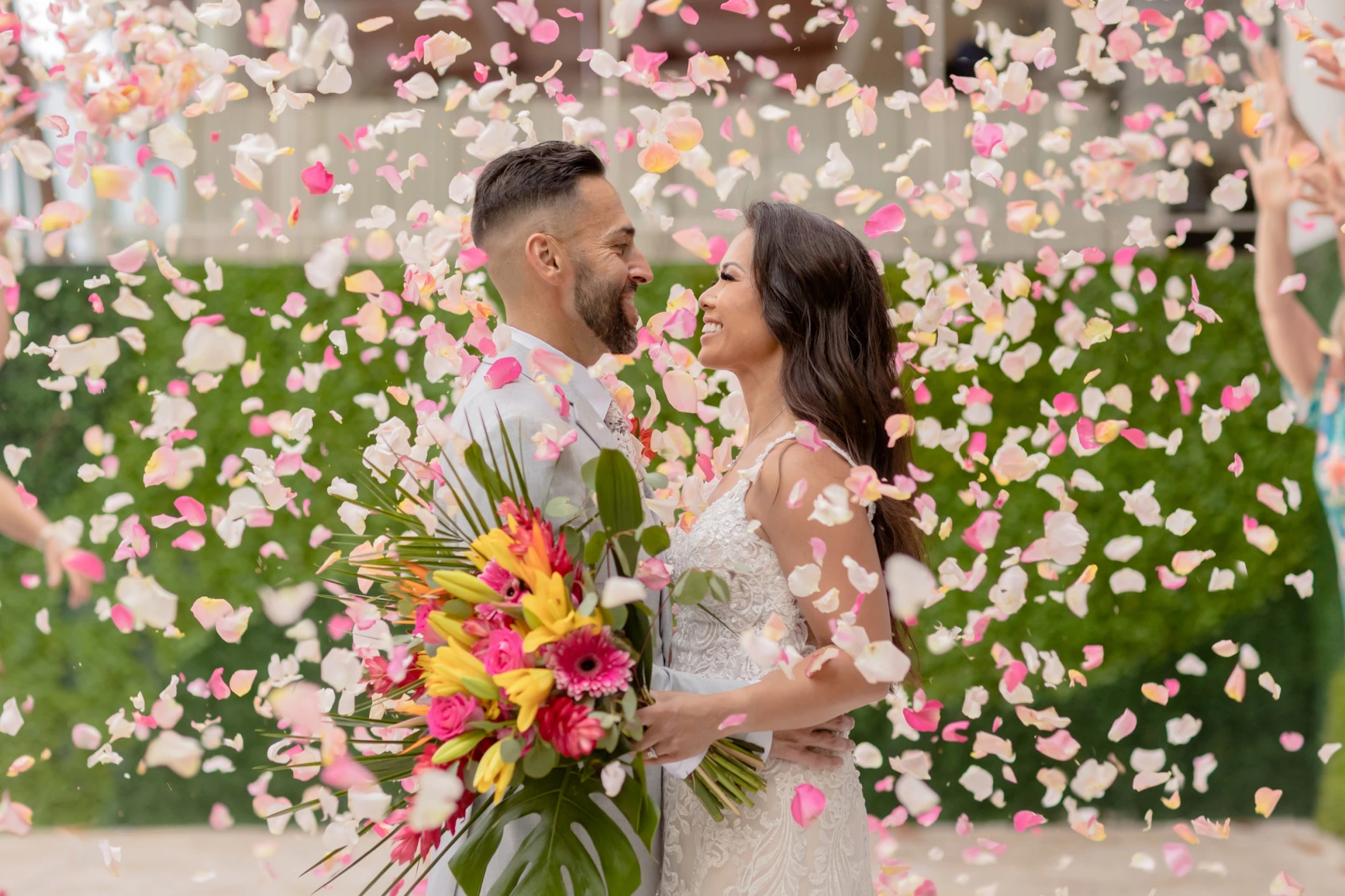 Melissa & Josh being showered with flower petals