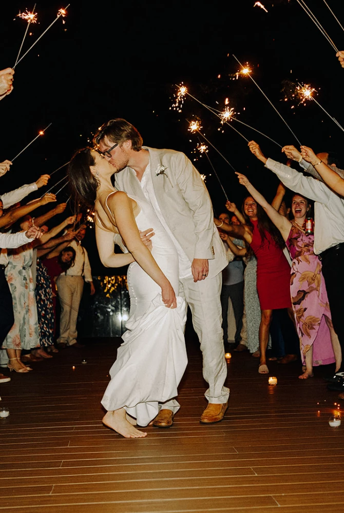 Stephanie & Austin kiss as the guests cheer