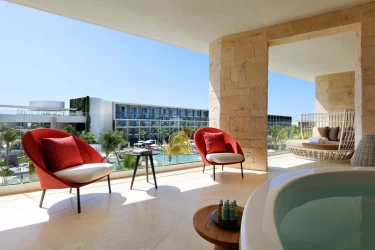 TRS Coral ambassador suite balcony with hot tub and chairs