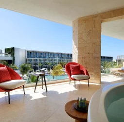 TRS Coral ambassador suite balcony with hot tub and chairs