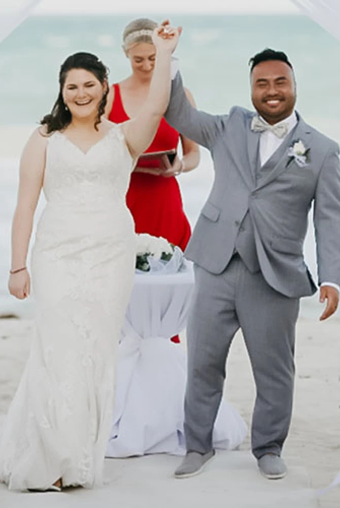 Newly-weds celebrate their ceremony at the beach