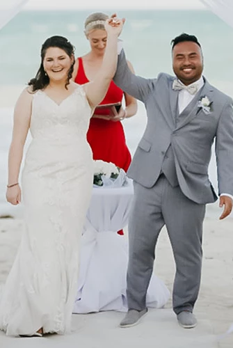 Newly-weds celebrate their ceremony at the beach