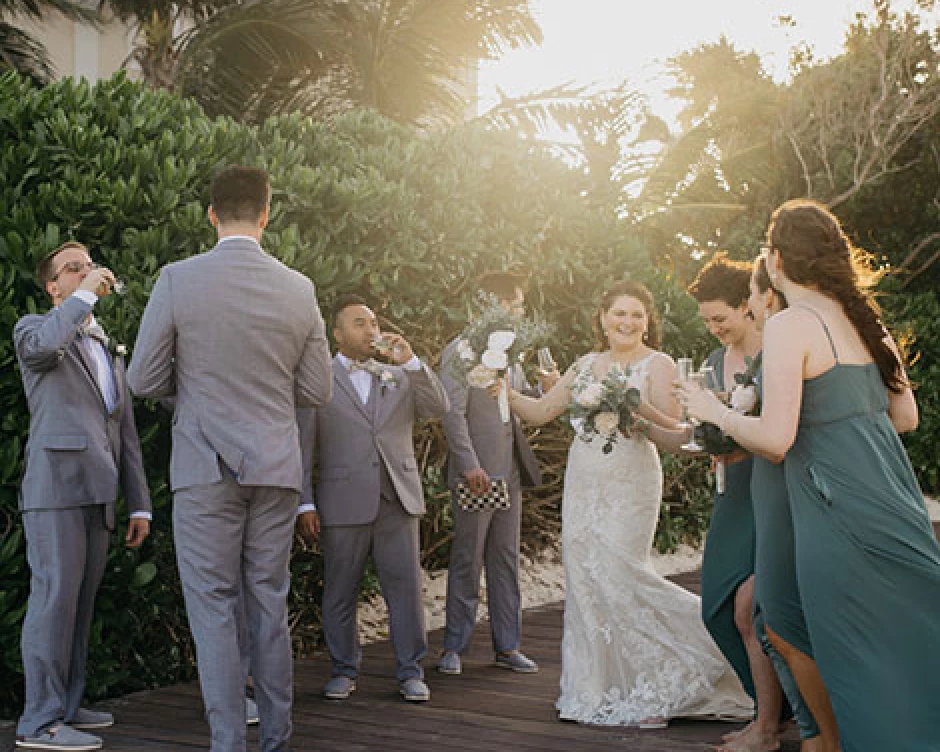 Groom and bride enjoying some time with their wedding party