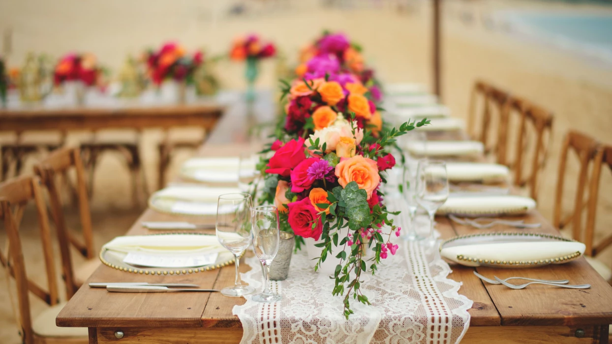 Dinner reception decor on the beach wedding venue at Villa La Estancia Los Cabos