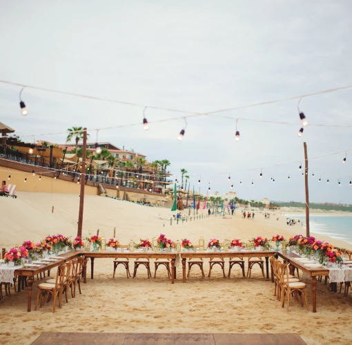 Dinner reception decor on the beach wedding venue at Villa La Estancia Los Cabos