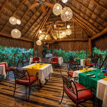 Restaurant with tropical garden views at Viva Wyndham Maya Resort