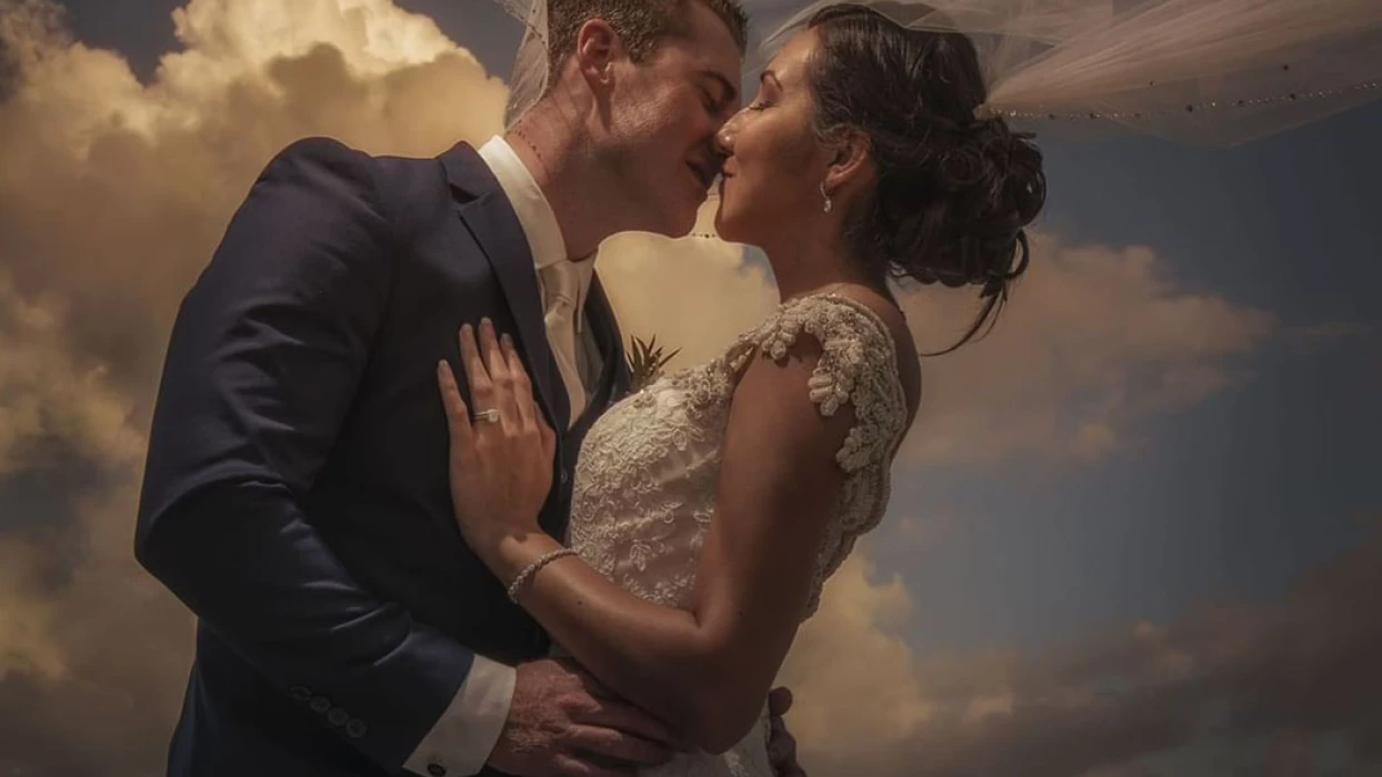 Just married couple kissing each other at Haven Riviera Cancun.