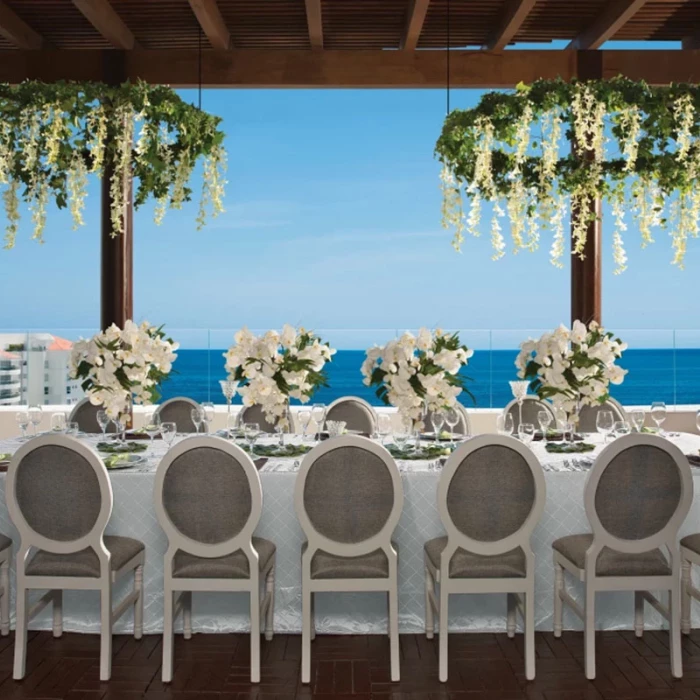 Wedding dinner setup on terrace at Wyndham Alltra Riviera Nayarit