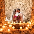 Couple kissing at the light of the candles