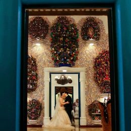 Wedding couple Kissing on a beautiful venue at Xcaret.